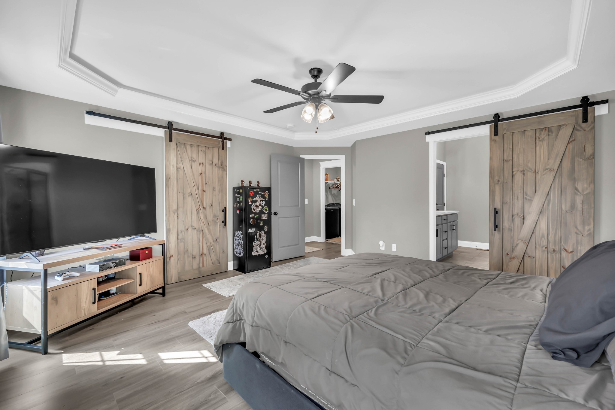 834 Limestone Way Clarksville, TN 37043 - Photo 16 of 26 a bedroom with a bed and a flat screen tv