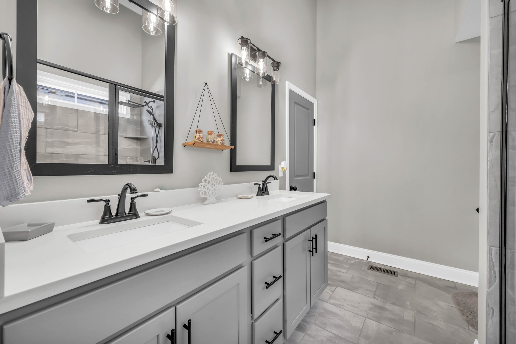 834 Limestone Way Clarksville, TN 37043 - Photo 17 of 26 a bathroom with a double vanity sink and a mirror