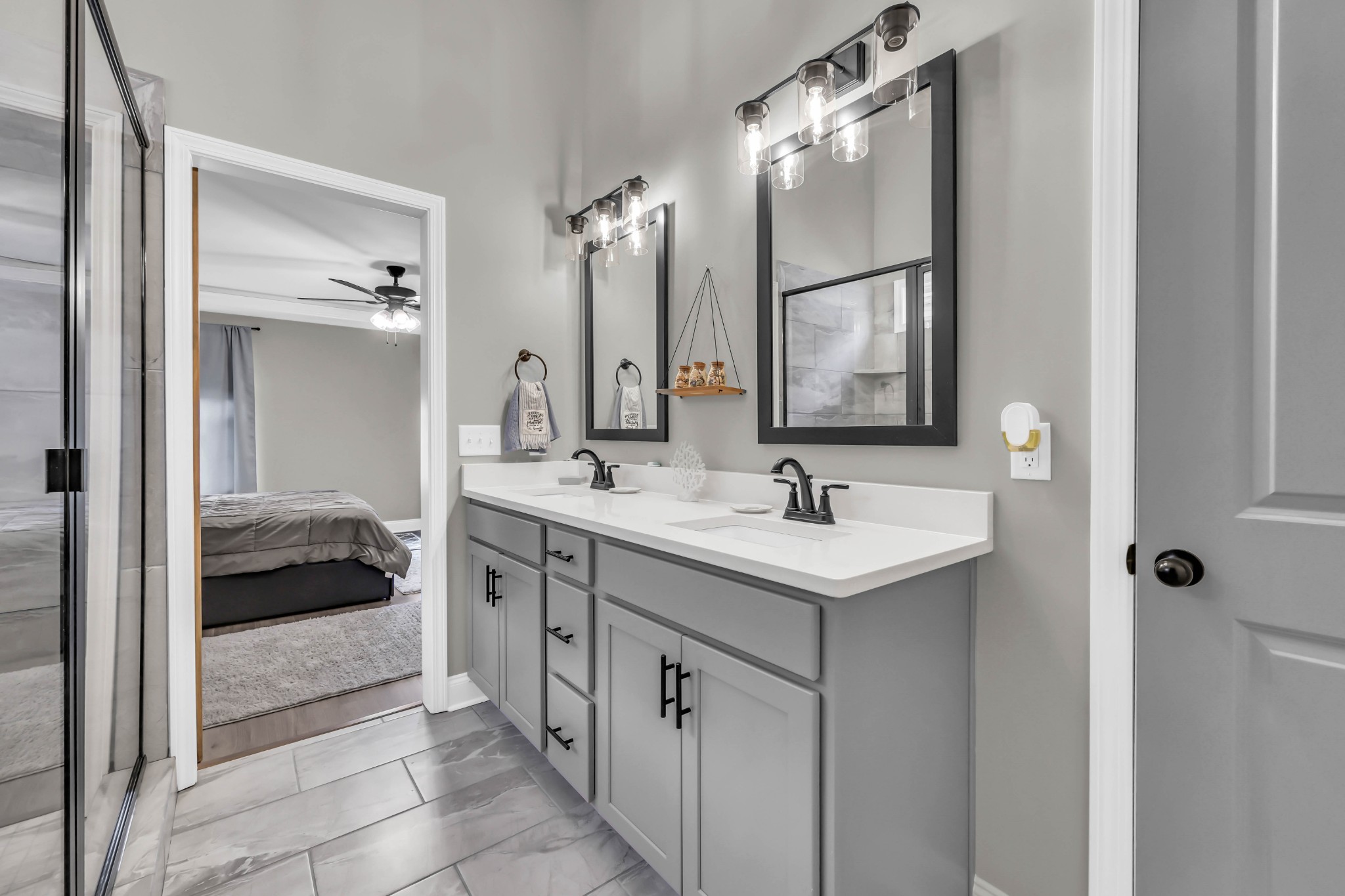 834 Limestone Way Clarksville, TN 37043 - Photo 19 of 26 a en suite bathroom with a sink and a mirror
