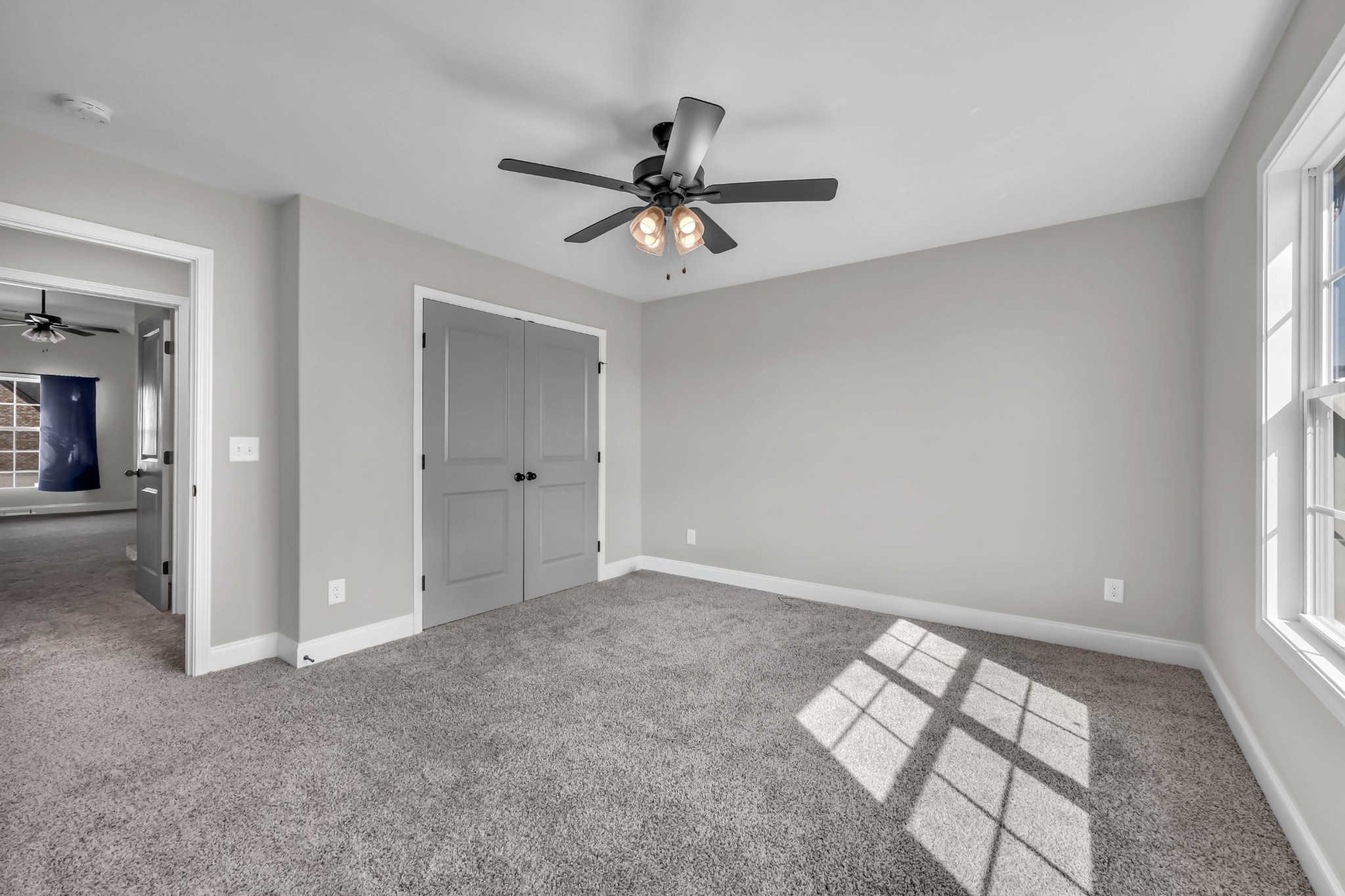 834 Limestone Way Clarksville, TN 37043 - Photo 21 of 26 an empty room with windows and fan