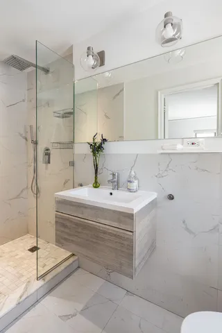 a bathroom with a bathtub and a sink