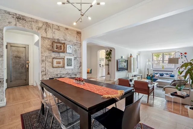 a dining room with a table and chairs