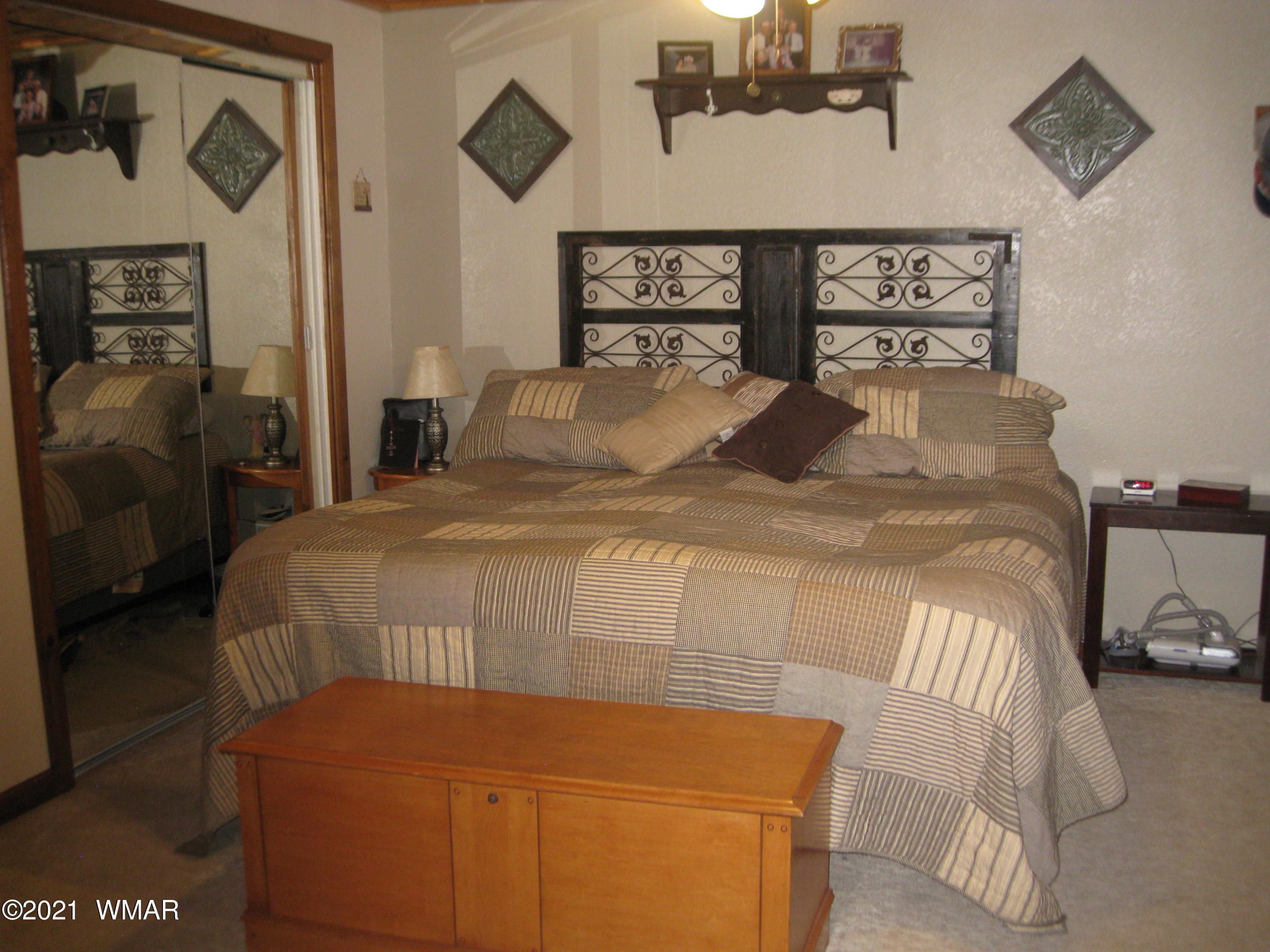 2091 Ranger Road Overgaard, AZ 85933 - Photo 16 of 66 a bedroom with a bed and window