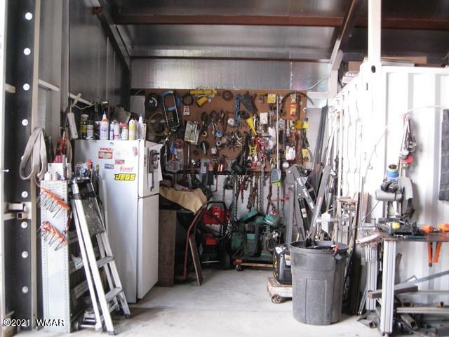 2091 Ranger Road Overgaard, AZ 85933 - Photo 46 of 66 a view of walk in closet with clothes