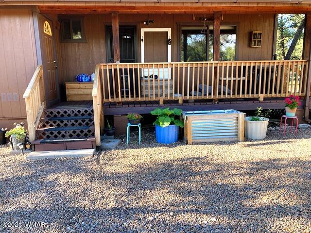 2091 Ranger Road Overgaard, AZ 85933 - Photo 51 of 66 a view of a house with a small yard and wooden fence