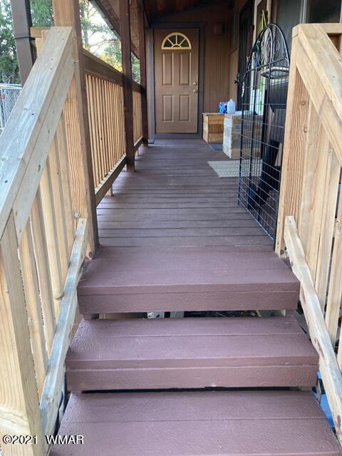 2091 Ranger Road Overgaard, AZ 85933 - Photo 53 of 66 a view of staircase with wooden floor and a window