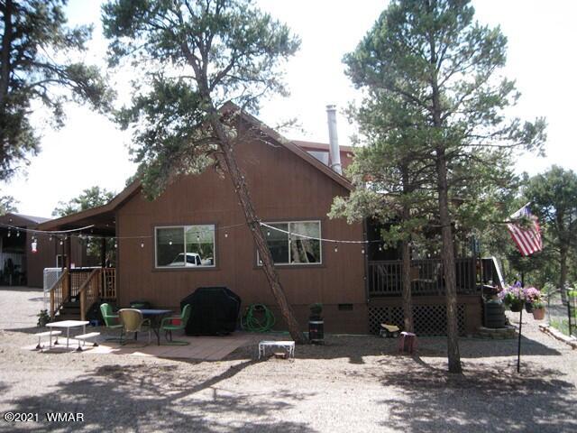 2091 Ranger Road Overgaard, AZ 85933 - Photo 60 of 66 a backyard of a house with seating space