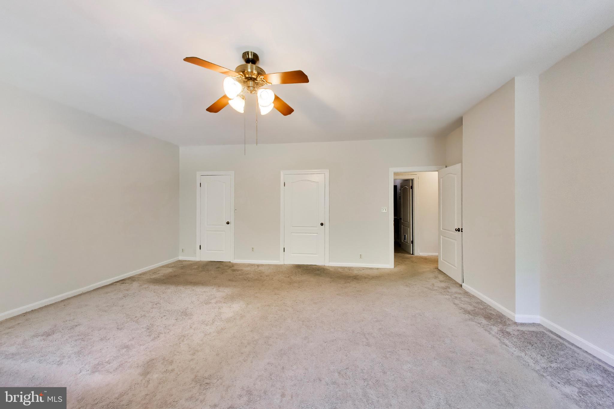 11906 Claridge Road Silver Spring, MD 20902 - Photo 18 of 41 Large primary bedroom with ceiling fan