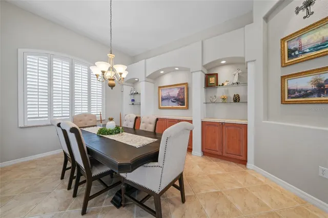 a spacious bathroom with a double vanity sink mirror and a bathtub with shower