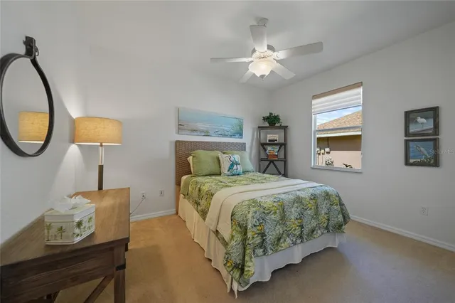 a view of swimming pool with a couches chairs and city view