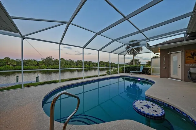 a kitchen with stainless steel appliances granite countertop a sink a counter top space and cabinets
