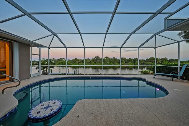 a view of a lake with a house in the background