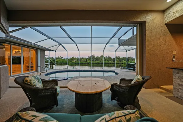 an aerial view of a houses with a swimming pool