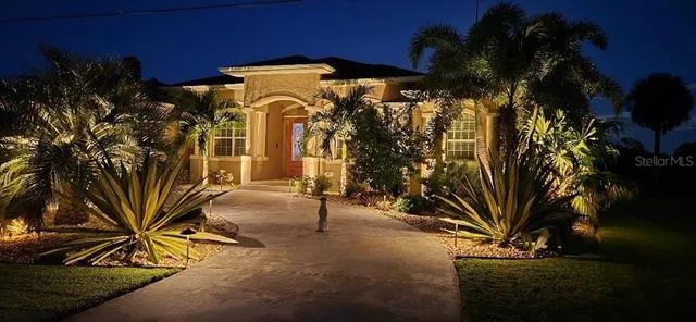 a view of a dining room with furniture and a window