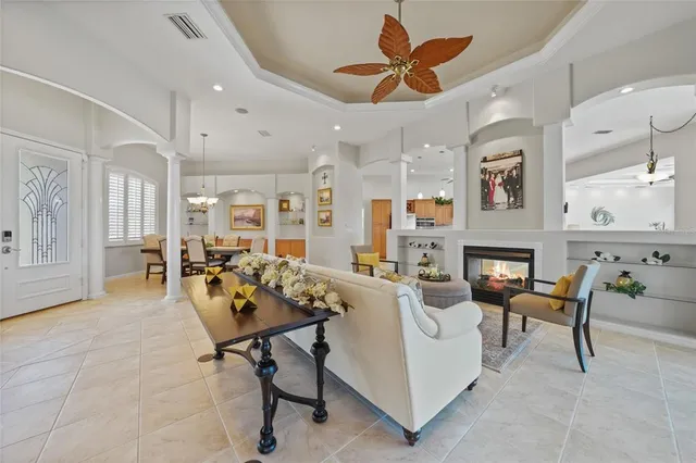 a bedroom with a large bed lamps and table