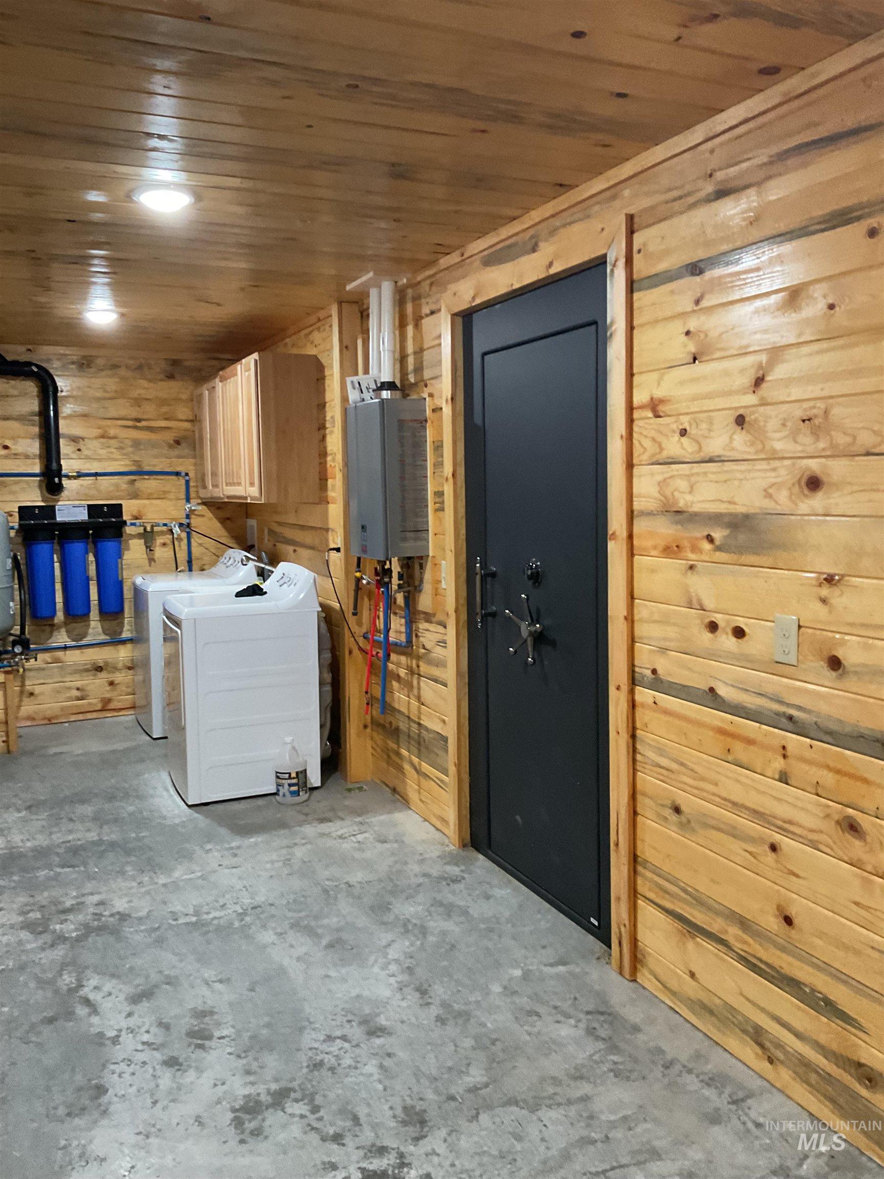 625 Rhett Creek Road Elk City, ID 83525 - Photo 46 of 48 Utility room featuring wood-paneled walls and ceiling, concrete flooring, and recessed lighting
