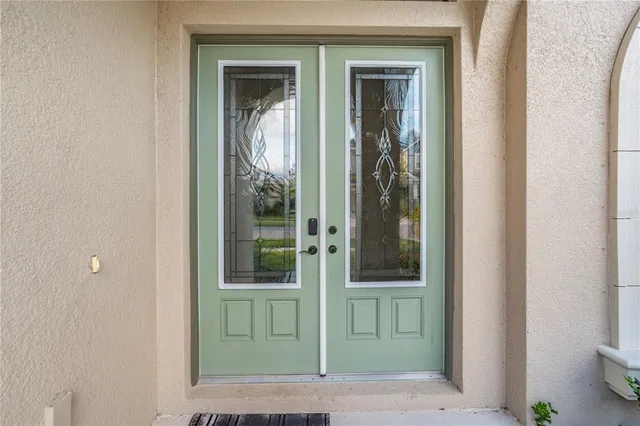 a building outdoor space with patio furniture and potted plants