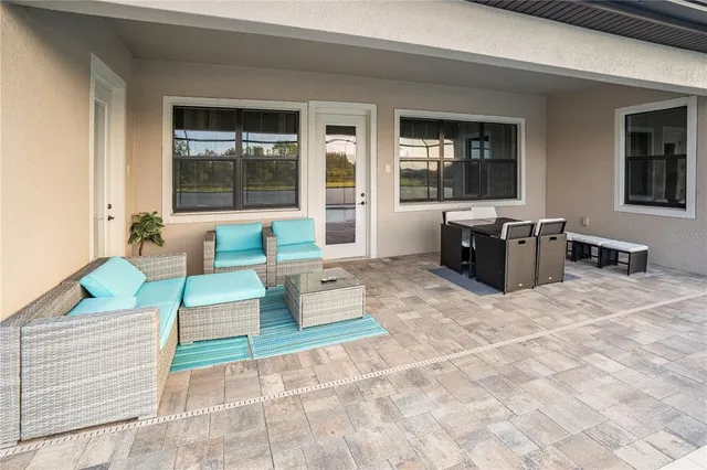 a bathroom with a granite countertop sink mirror vanity and toilet