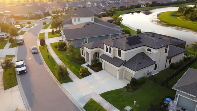 an aerial view of houses with a city street