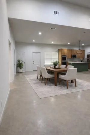 a kitchen with stainless steel appliances granite countertop a stove microwave and refrigerator