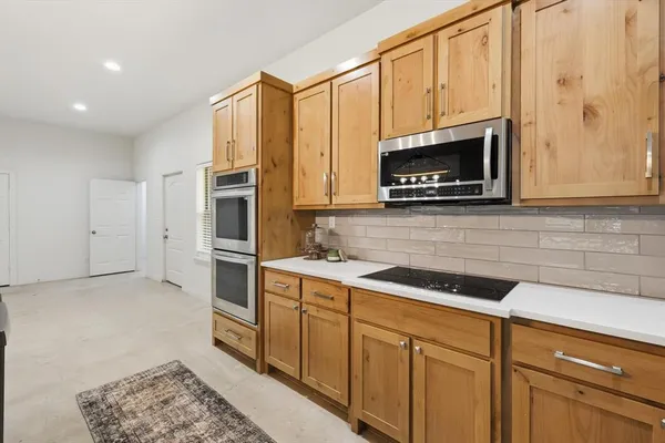 a view of kitchen with table and chair
