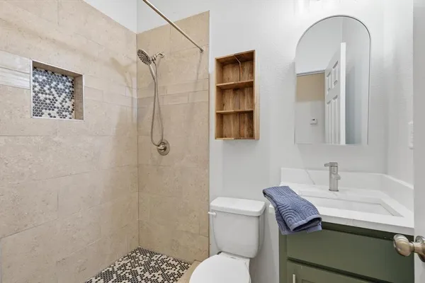 an aerial view of residential houses with outdoor space and swimming pool