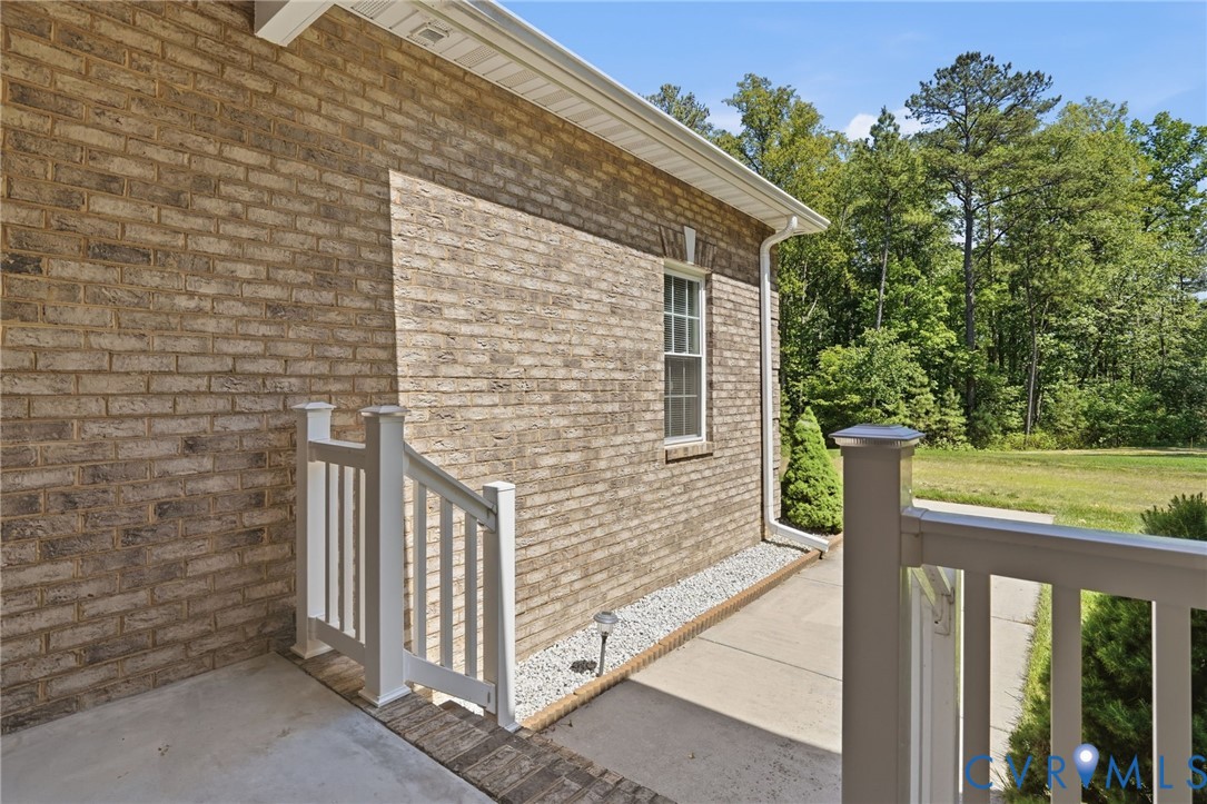 3600 Market Road Mechanicsville, VA 23111 - Photo 6 of 67 a view of a brick house with wooden fence and floor