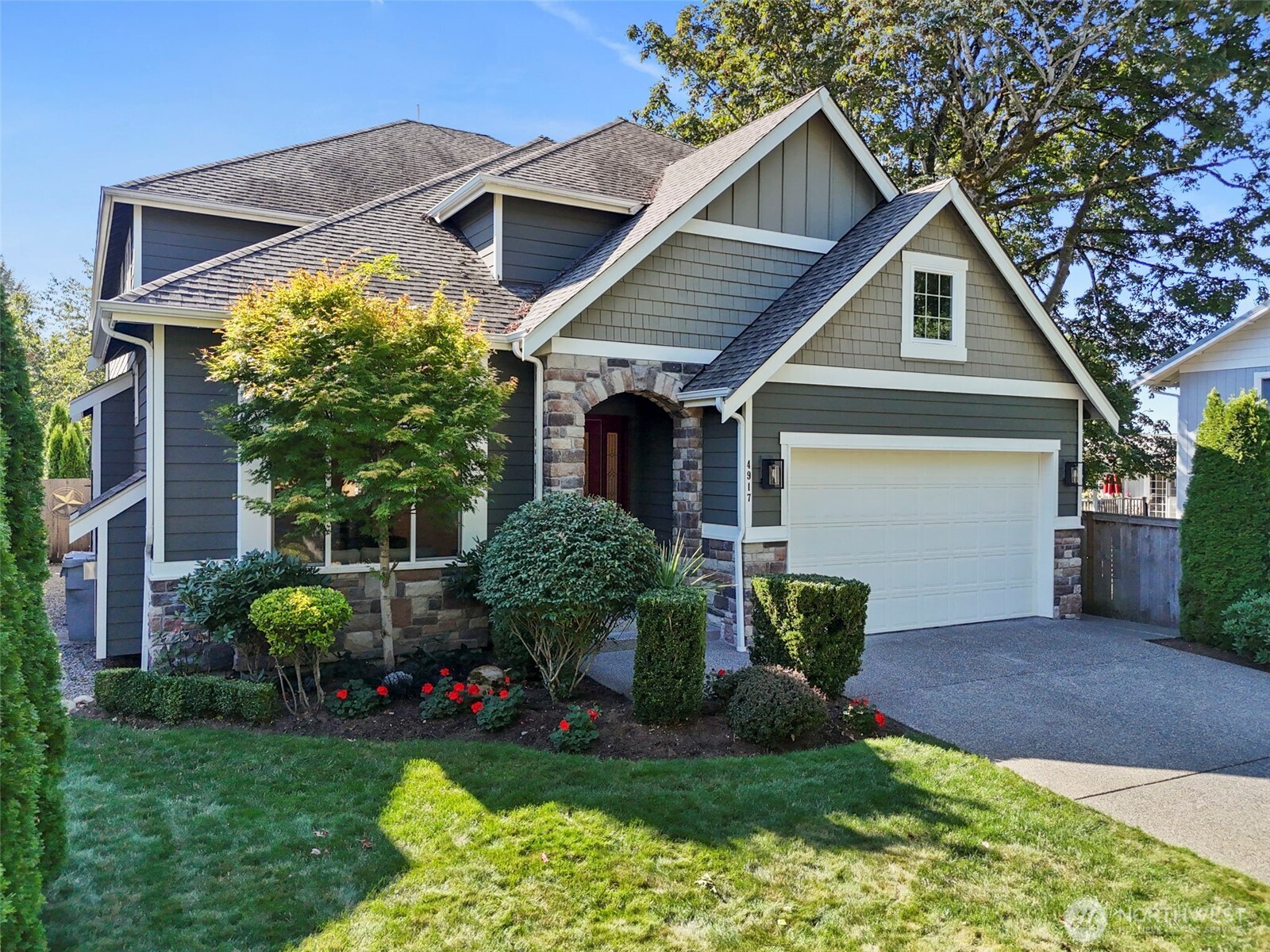 a front view of house with yard and green space