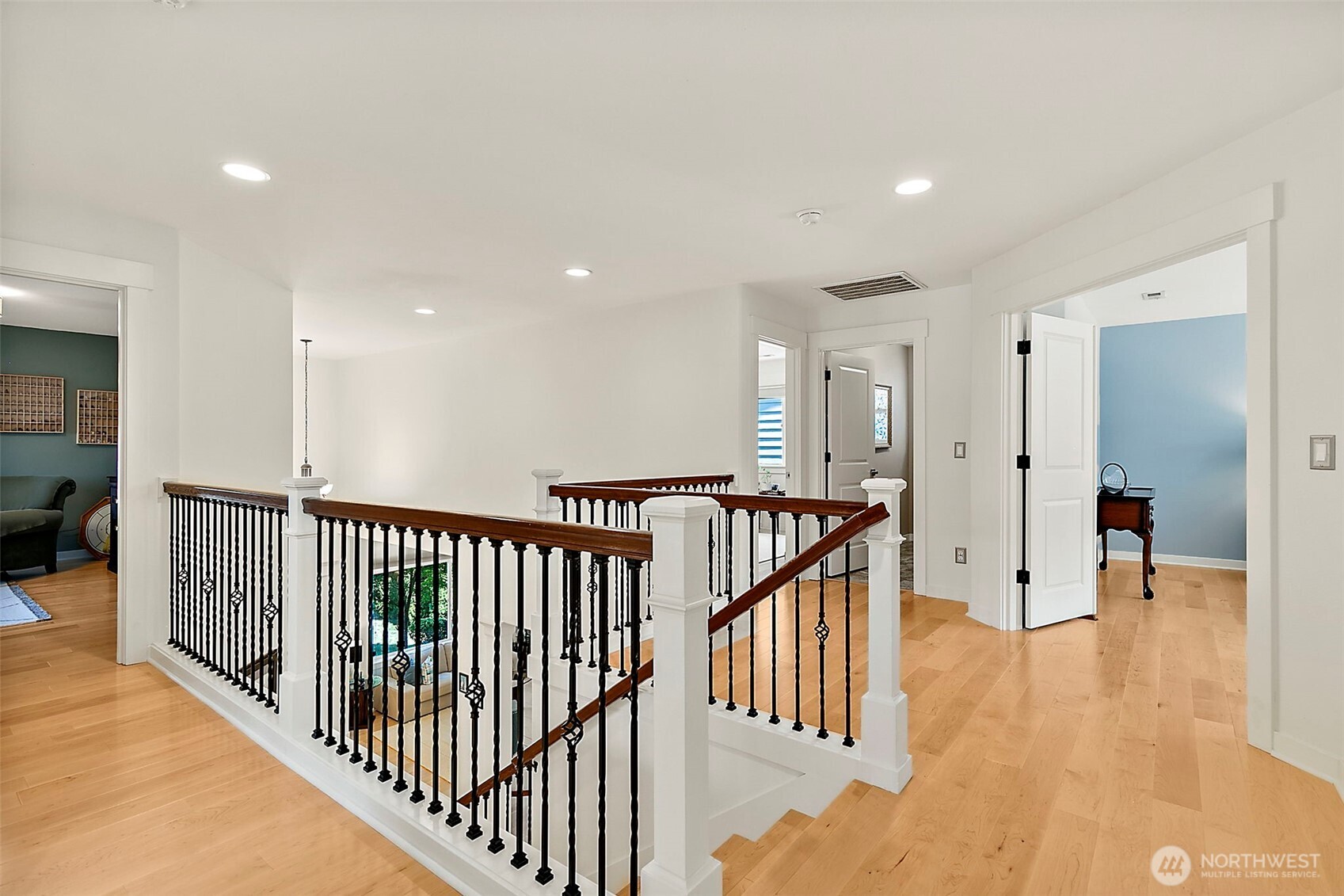 4917 Northeast 8th Street Renton, WA 98059 - Photo 17 of 37 a view of a hallway with wooden floor and windows