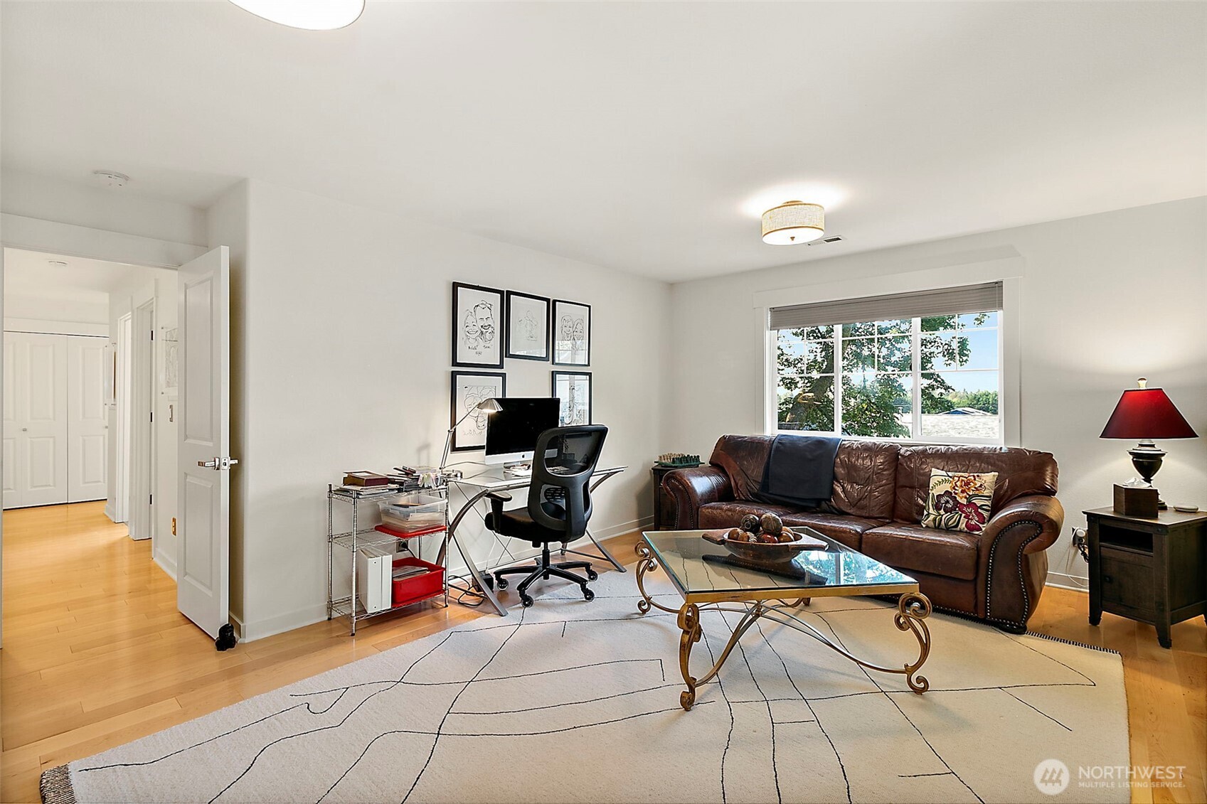 4917 Northeast 8th Street Renton, WA 98059 - Photo 28 of 37 a living room with furniture and a window