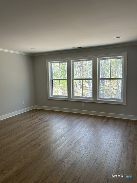 35 Village Circle, Unit 35 Hamden, CT 06514 - Photo 11 of 14 an empty room with wooden floor and windows