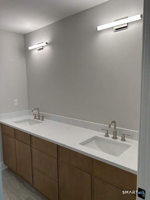 35 Village Circle, Unit 35 Hamden, CT 06514 - Photo 12 of 14 a bathroom with a sink and a mirror