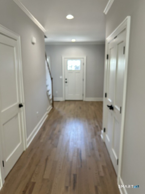 35 Village Circle, Unit 35 Hamden, CT 06514 - Photo 3 of 14 wooden floor in an empty room with a window