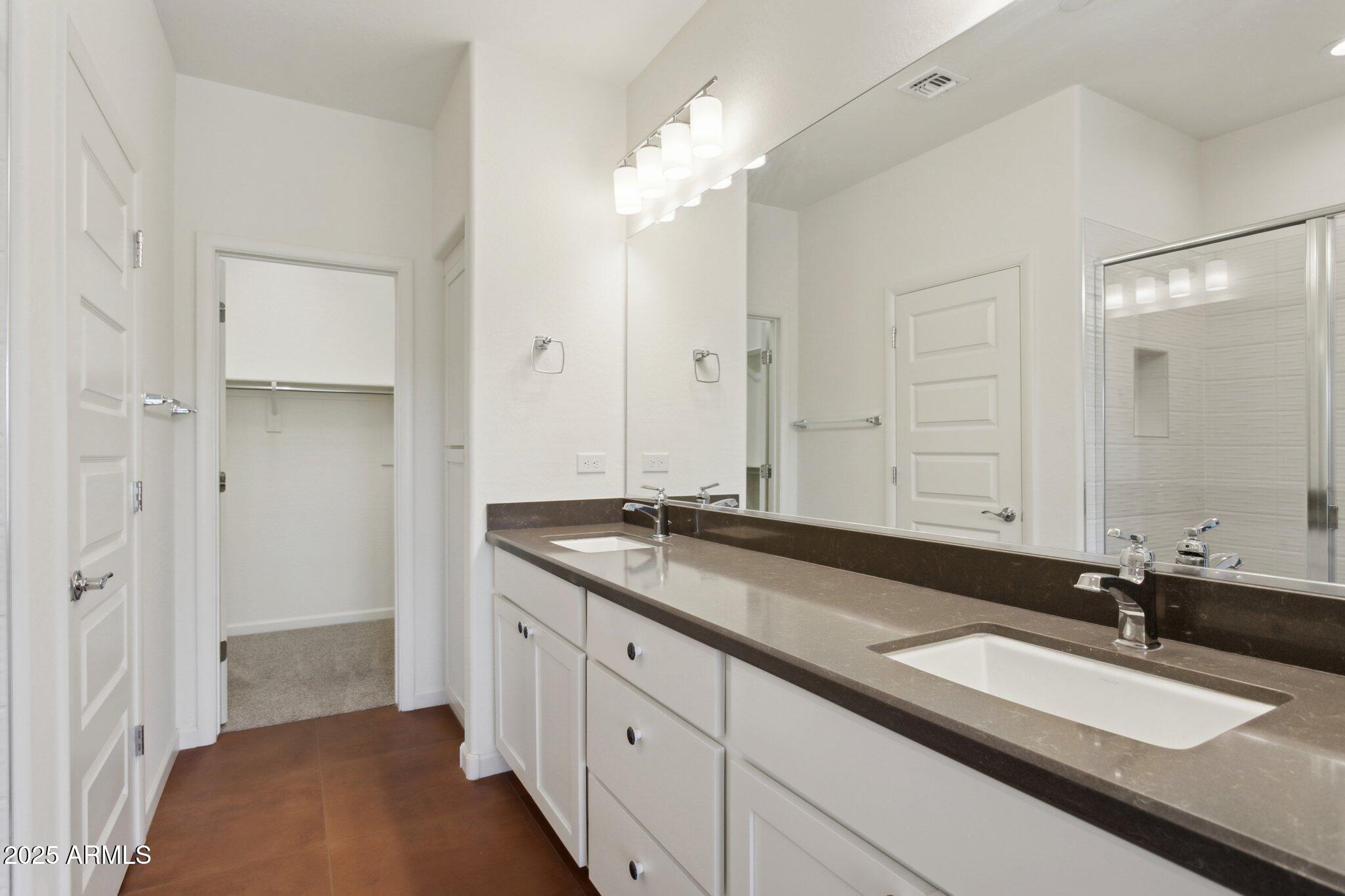 18324 East Spring Valley Court Rio Verde, AZ 85263 - Photo 19 of 39 a spacious bathroom with a granite countertop sink and a mirror