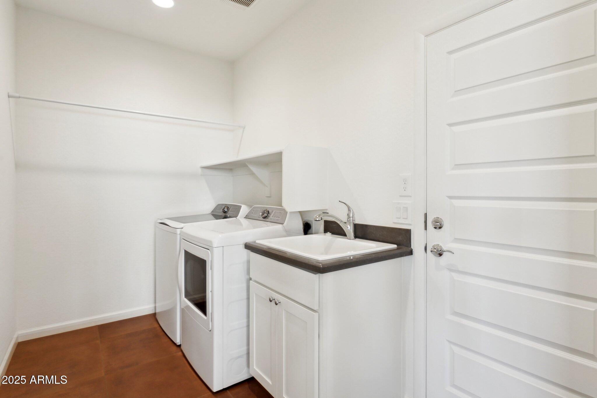 18324 East Spring Valley Court Rio Verde, AZ 85263 - Photo 25 of 39 a utility room with dryer and washer