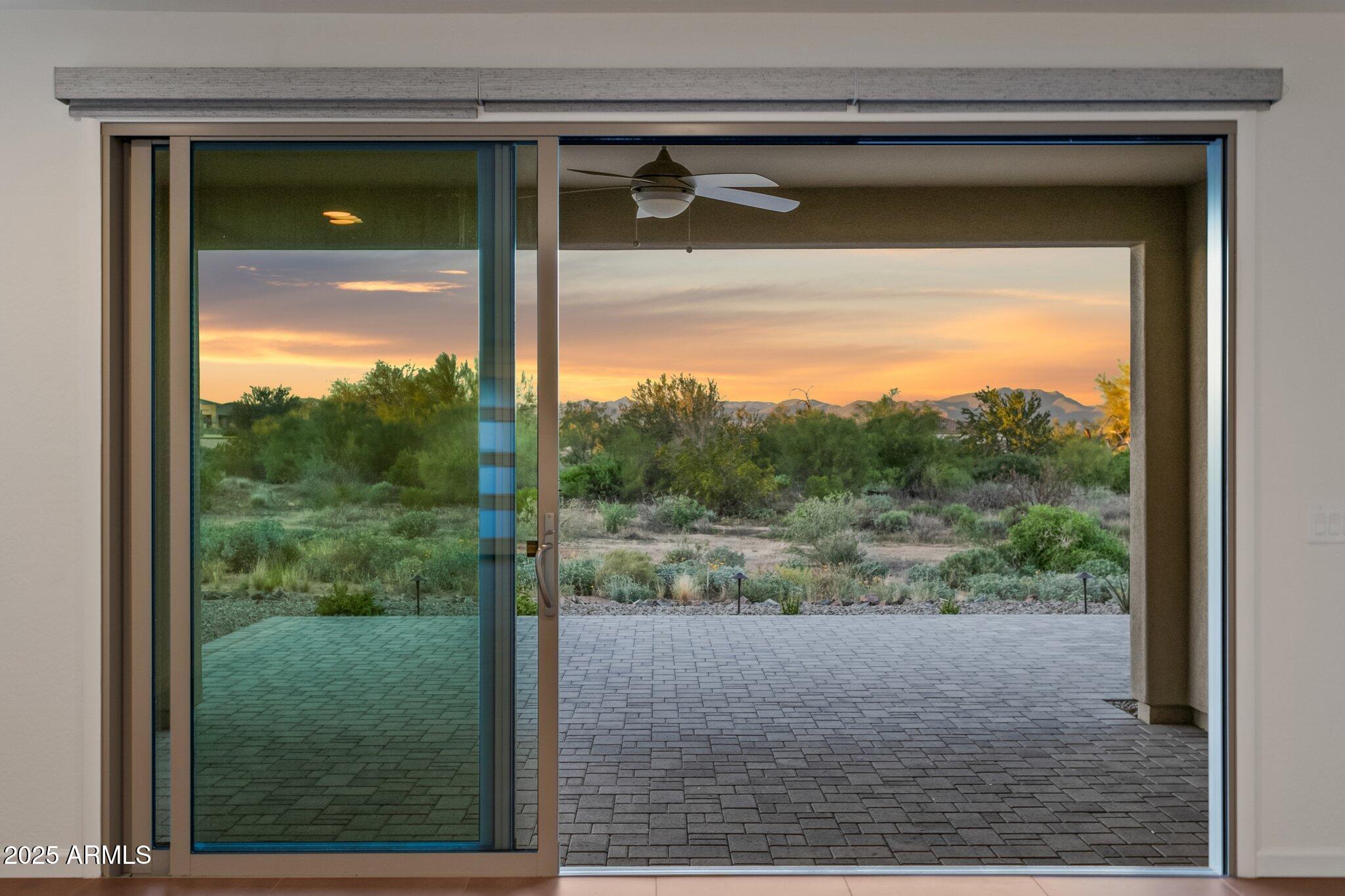 18324 East Spring Valley Court Rio Verde, AZ 85263 - Photo 26 of 39 a view of a glass door and a yard from a window