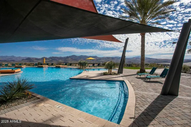 a view of a swimming pool and lounge chair