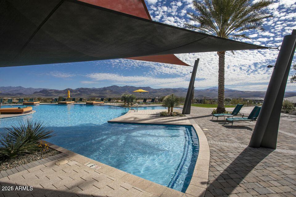 18324 East Spring Valley Court Rio Verde, AZ 85263 - Photo 36 of 39 a view of a swimming pool and lounge chair