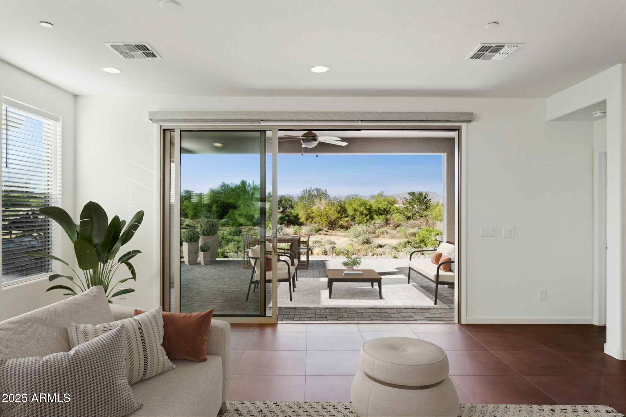 18324 East Spring Valley Court Rio Verde, AZ 85263 - Photo 5 of 39 a living room with furniture and a large window