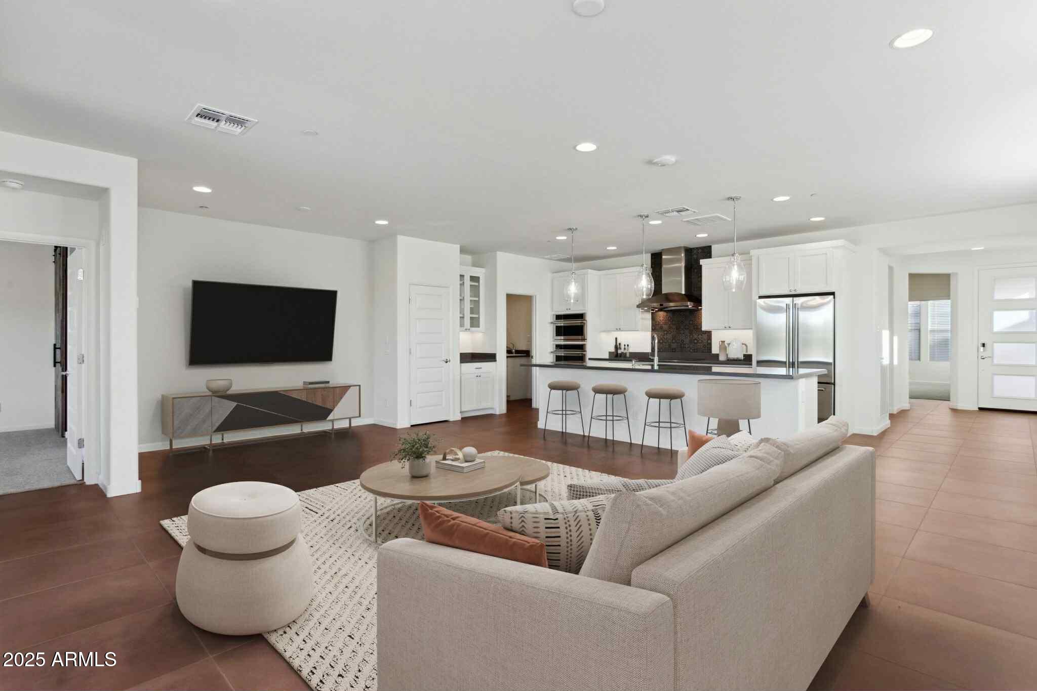 18324 East Spring Valley Court Rio Verde, AZ 85263 - Photo 6 of 39 a living room with furniture and a flat screen tv