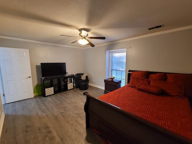 5285 Orangewood Road Memphis, TN 38134 - Photo 14 of 25 The master down is spacious, offers new Pergo laminate flooring, fresh paint, and a large walk-in closet.