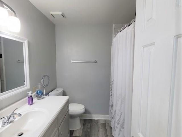 5285 Orangewood Road Memphis, TN 38134 - Photo 16 of 25 This full bath downstairs has been renovated to include a new vanity, lighting, tiles and paint color! This bathroom is used by the master down and as a guest bathroom.