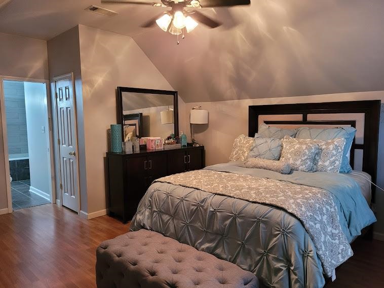 5285 Orangewood Road Memphis, TN 38134 - Photo 17 of 25 The second master bedroom located upstairs offers an abundance of space - and it's own full bath too! There are built-ins for storage, laminate wood flooring and fresh paint.