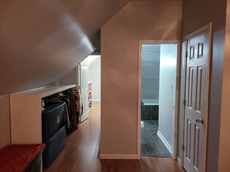 5285 Orangewood Road Memphis, TN 38134 - Photo 19 of 25 This view from the master up shows entry to the full bath on the right, and storage on the left. The hallway straight ahead leads to the staircase, the loft area, and to the third bedroom.