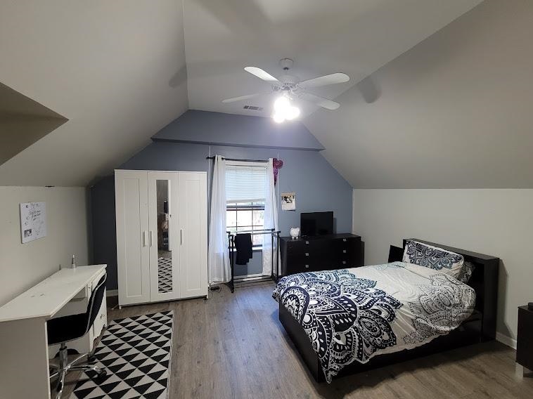 5285 Orangewood Road Memphis, TN 38134 - Photo 22 of 25 The third bedroom is located upstairs just off the loft area. This room also features laminate wood flooring, custom paint color and a walk-in closet large enough to be a study!