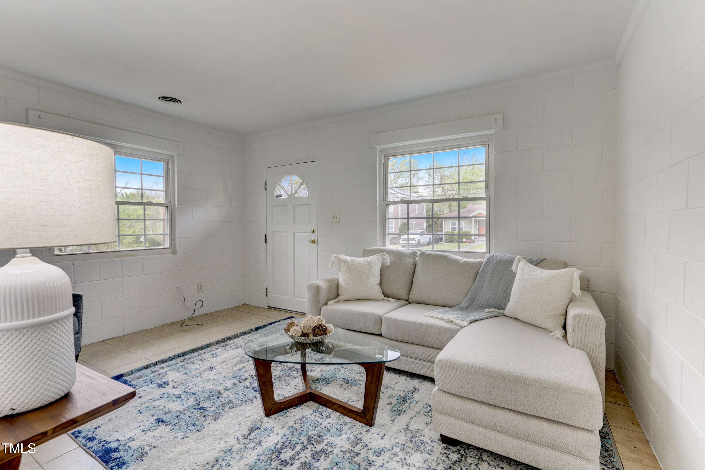 830 Lenoir Street Raleigh, NC 27601 - Photo 7 of 15 a living room with furniture and a window