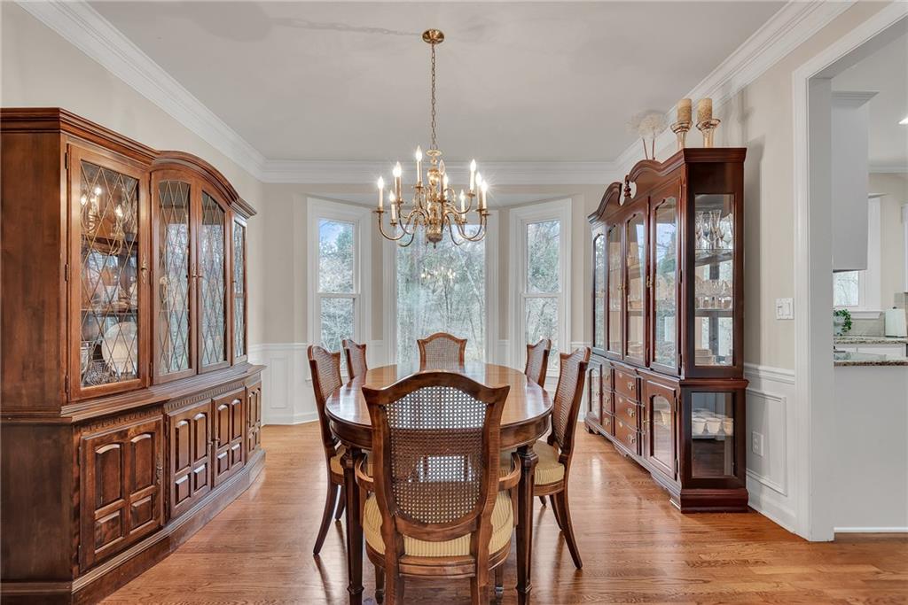 520 Fawn Run Alpharetta, GA 30005 - Photo 11 of 65 a view of a dining room with furniture window and wooden floor