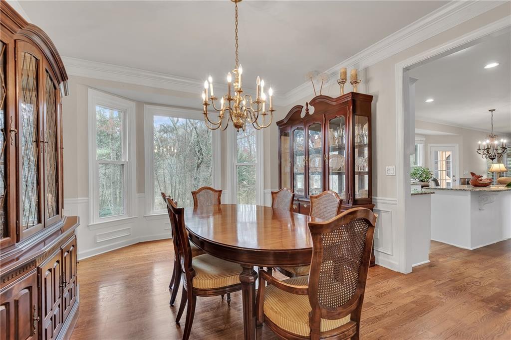 520 Fawn Run Alpharetta, GA 30005 - Photo 12 of 65 a view of a dining room with furniture window and wooden floor