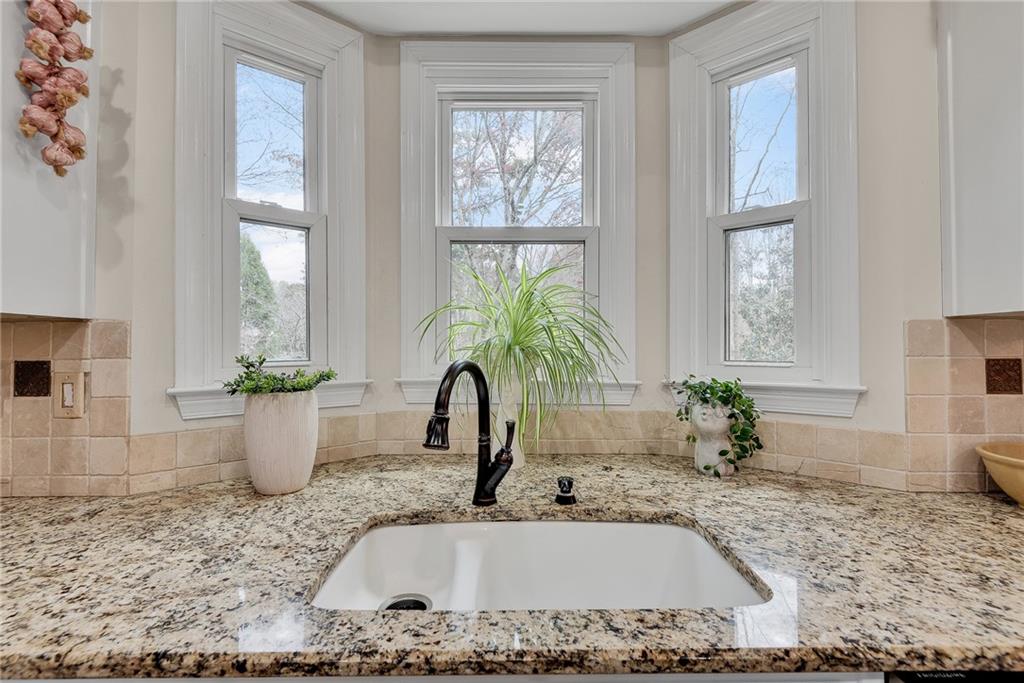 520 Fawn Run Alpharetta, GA 30005 - Photo 18 of 65 a kitchen with a window a sink and potted plant