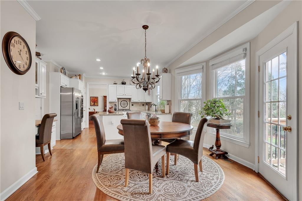 520 Fawn Run Alpharetta, GA 30005 - Photo 21 of 65 a view of a dining room with furniture window and wooden floor